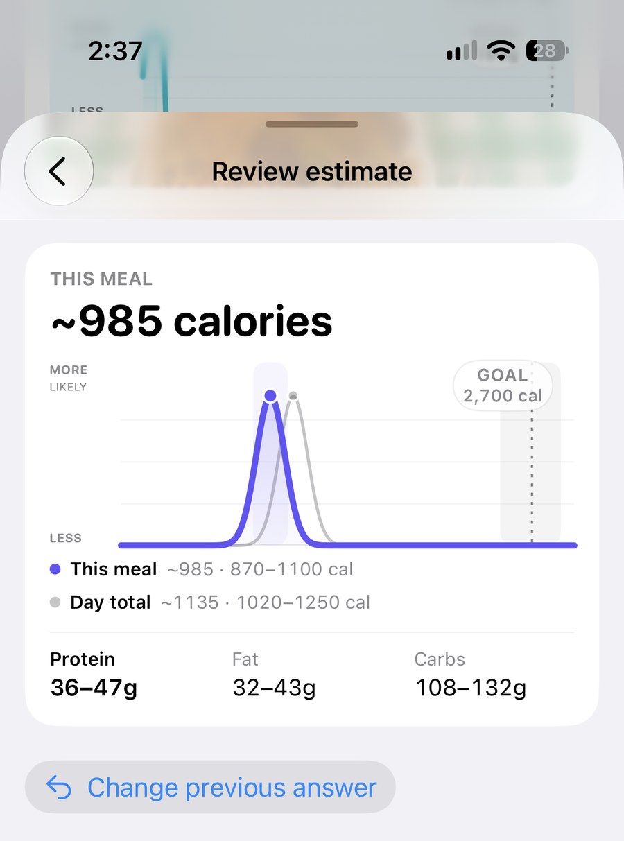 The same meal after setting amount eaten to one half, showing 985 calories